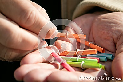 Hand holding a lots of raffle tickets, tombola and lottery Stock Photo