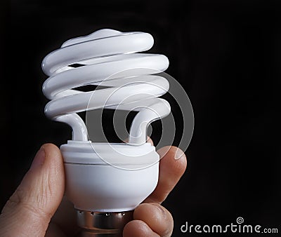 Hand Holding Low Energy Lightbulb Stock Photo