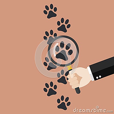 Hand holding magnifying glass over paw print Vector Illustration