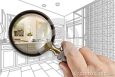 Hand Holding Magnifying Glass Revealing Custom Bathroom Design Drawing and Photo Combination Stock Photo