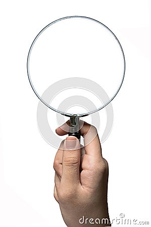 Hand Holding Magnifying Glass in Vertical Stock Photo