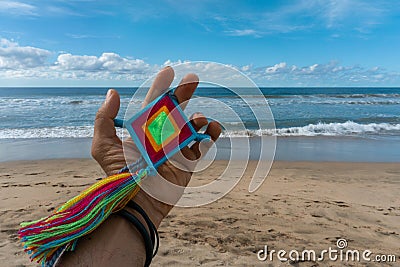 Hand Holding Mandala Eye of God Mexican Huichol Crafts Stock Photo