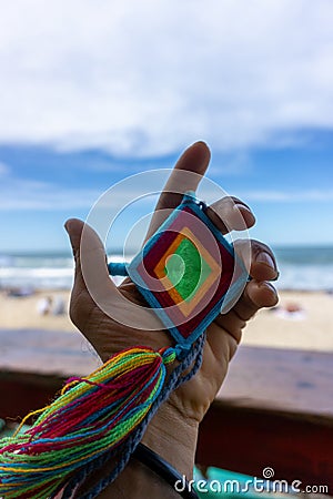 Hand Holding Mandala Eye of God Mexican Huichol Crafts Stock Photo