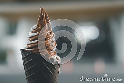 Hand holding mixed flavor soft cream in waffle Stock Photo