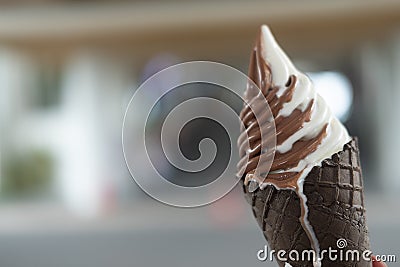 Hand holding mixed flavor soft cream in waffle Stock Photo