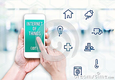 Hand holding mobile phone with Internet of things IoT with fea Stock Photo