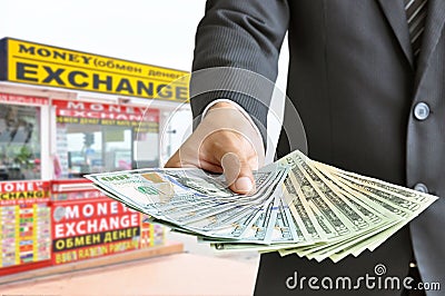 Hand holding money US dollar bills - money exchange concept Stock Photo