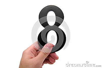 Hand holding number 8 Stock Photo