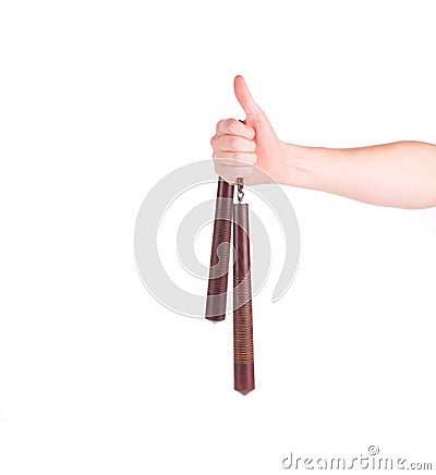 Hand holding nunchaku weapon. Stock Photo