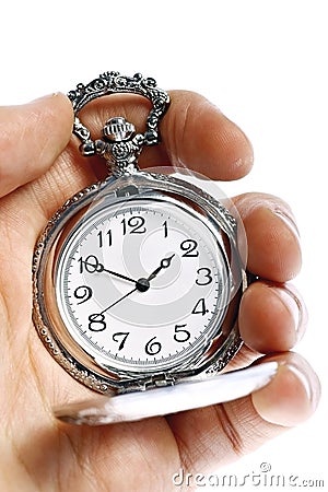 Hand holding old pocket watch Stock Photo