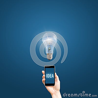 Hand holding a phone with the words idea. Stock Photo