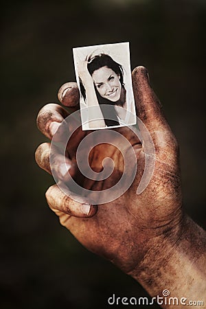 Hand, holding picture of woman and portrait, retro nostalgia or remember memory of family or partner on Stock Photo