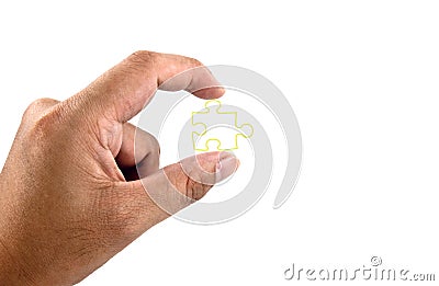 Hand holding piece of jigsaw Stock Photo