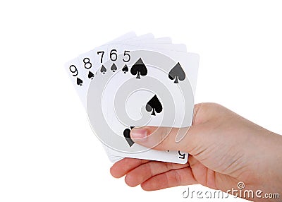 Hand holding playing cards straight flush isolated Stock Photo