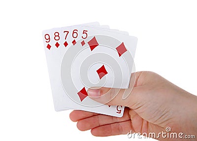 Hand holding Playing cards, a straight flush isolated Stock Photo