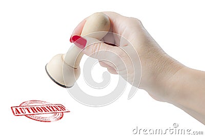 Hand holding a rubber stamp with the word authorized Stock Photo