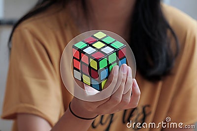 hand holding a Rubik's cube. Editorial Stock Photo