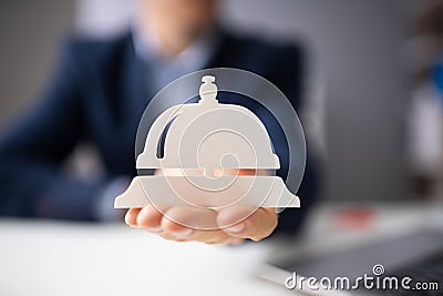 Hand Holding Service Bell Icon Stock Photo