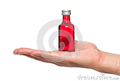 Hand holding a small bottle Stock Photo