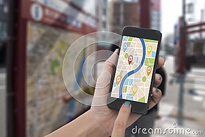 Hand holding smart phone with map gps navigation application. Stock Photo