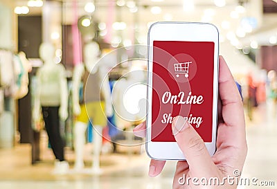 Hand holding smart phone with online shopping device on screen o Stock Photo