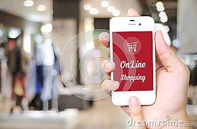 Hand holding smart phone with online shopping device on screen o Stock Photo