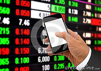 Hand Holding Smart Phone and Stock Data Stock Photo