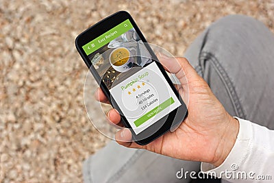 Hand holding smartphone with food application mock up on screen Stock Photo