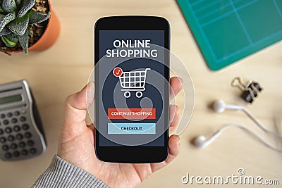 Hand holding smartphone with online shopping concept on screen Stock Photo