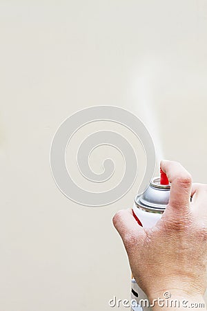 Hand holding Spray Paint Can Stock Photo