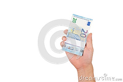 Hand holding stack of twenty euro bills isolated on white background with clipping path. Stock Photo