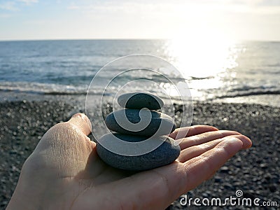 Hand holding stones. Stock Photo