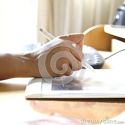 Hand holding stylus pen Stock Photo