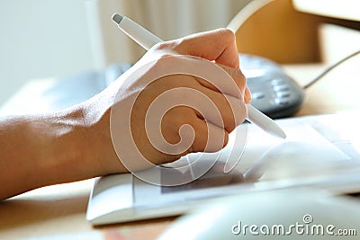 Hand holding stylus pen Stock Photo