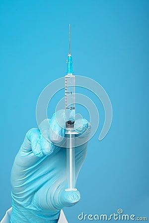 Woman`s hand holding syringe and medicine vial prepare for injection in operating room. Space for text Stock Photo