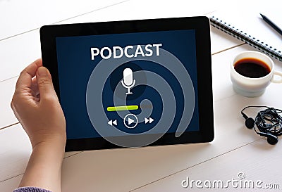 Hand holding tablet with podcast concept on screen Stock Photo