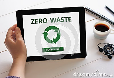 Hand holding tablet with zero waste concept on screen Stock Photo