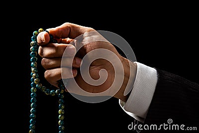 Hand Holding a Tasbih Stock Photo