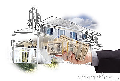 Hand Holding Thousands In Cash Over House Drawing and Photo Stock Photo