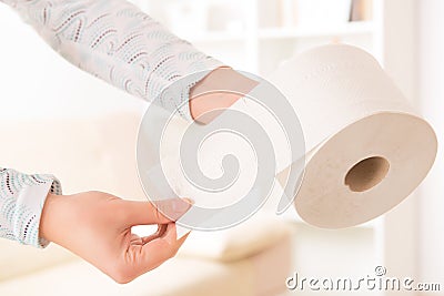 Hand holding toilet paper Stock Photo