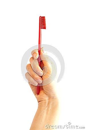 Hand holding toothbrush Stock Photo