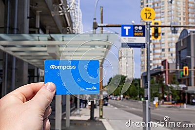 Hand holding a Translink Compass Card Editorial Stock Photo