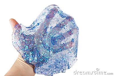 Hand holding a transparent blue glitter slime isolated on white Stock Photo