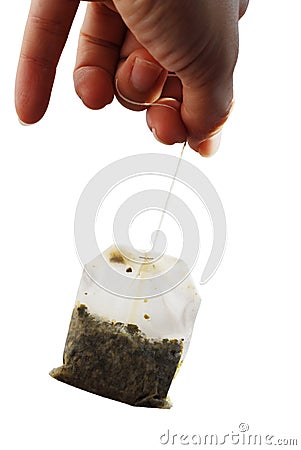 Hand Holding a Used Teabag Stock Photo