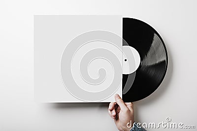 Hand holding vinyl music album template on white Stock Photo