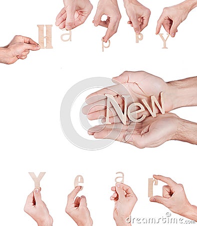 Hand holding Wood inscription Happy New Year Stock Photo