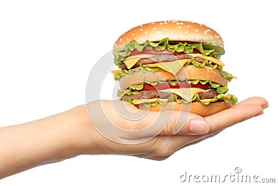 Hand holds big hamburger on white background Stock Photo
