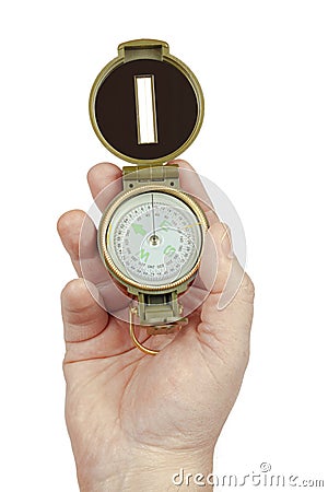 The hand holds the compass on a white background, isolate Stock Photo