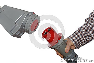 Hand holds electrical plug Stock Photo