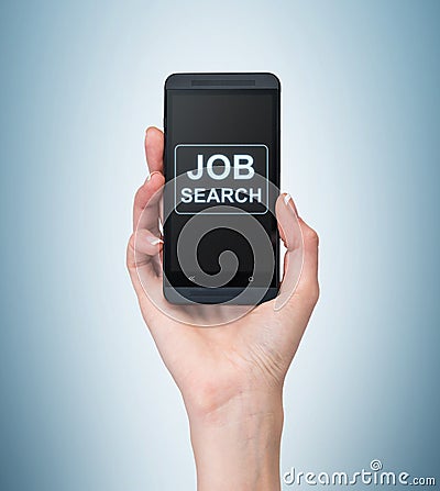 A hand holds a fancy smartphone. Words: ' Job search ' on the screen. A concept of recruitment. Stock Photo